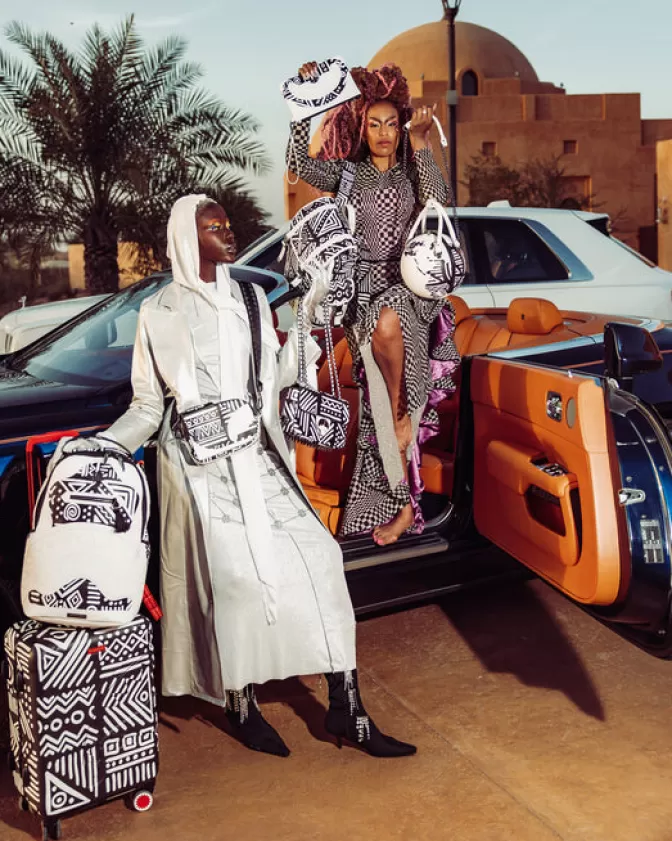Sprayground Zaini a Tracolla | Borsa Crossbody Africana A.I.8 - Storia Originale con Design Tribale

(：