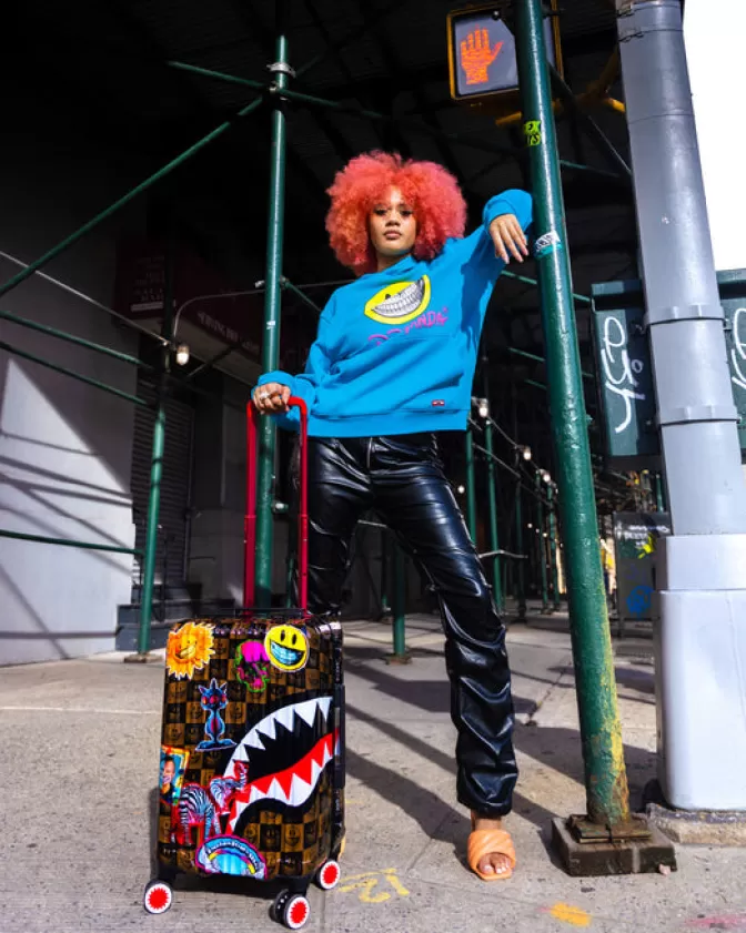 Valigia Cabina Antigurto Sprayground - Edizione Limitata Ron English con Grafiche Pop Art, Bagaglio Rigido da Viaggio Trend del Momento