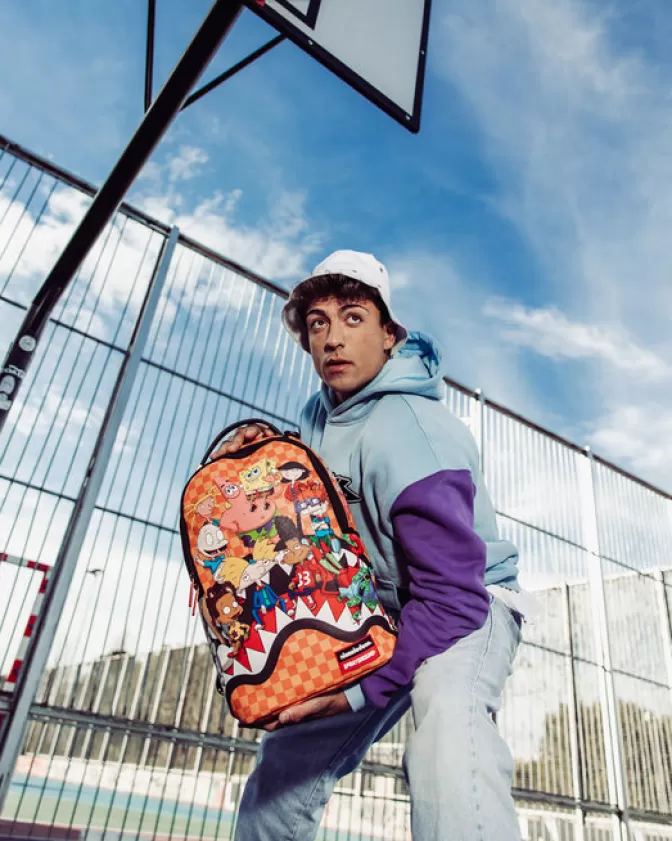 Zaino Sprayground Stile Streetwear - Edizione Shark Feast di Nickelodeon con Tasche Multifunzionali (Modello DLXV) per Adolescenti e Adulti, Design Irriverente con Motivo Subacqueo, Capienza 30L Ideale per Scuola e Viaggi.