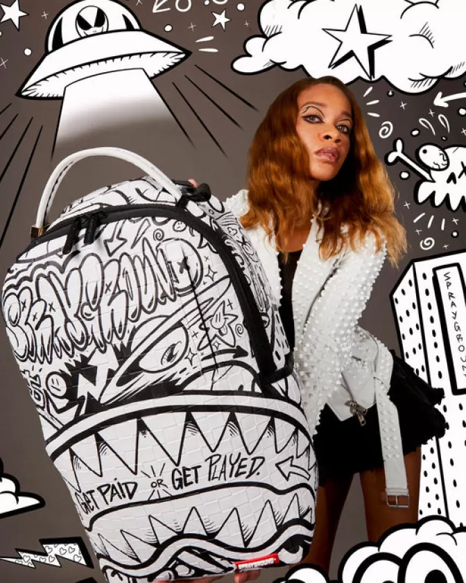 Zaino Sprayground DLXV: Il Compagno Perfetto per le Feste Post-Stipendio 

(Note: 
