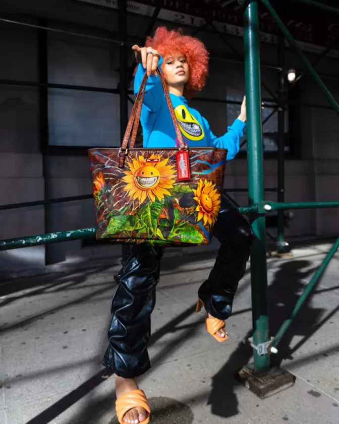 Sprayground Borsa Tracolla con Stampa Girasole Sorridente - Edizione Esclusiva Ron English