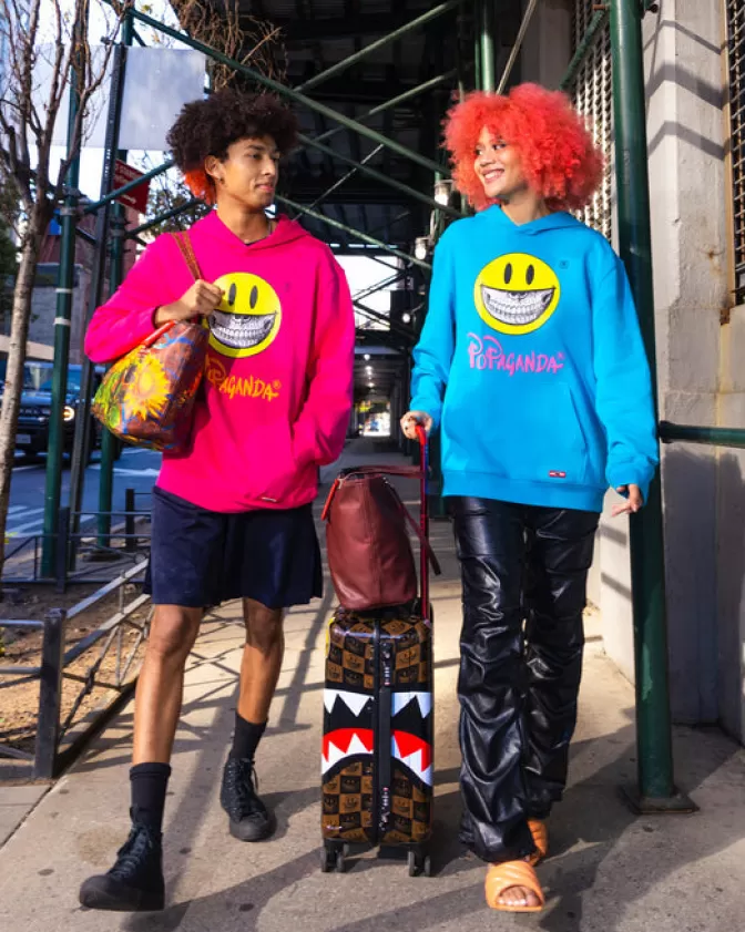Sprayground Borsa Tracolla con Stampa Girasole Sorridente - Edizione Esclusiva Ron English
